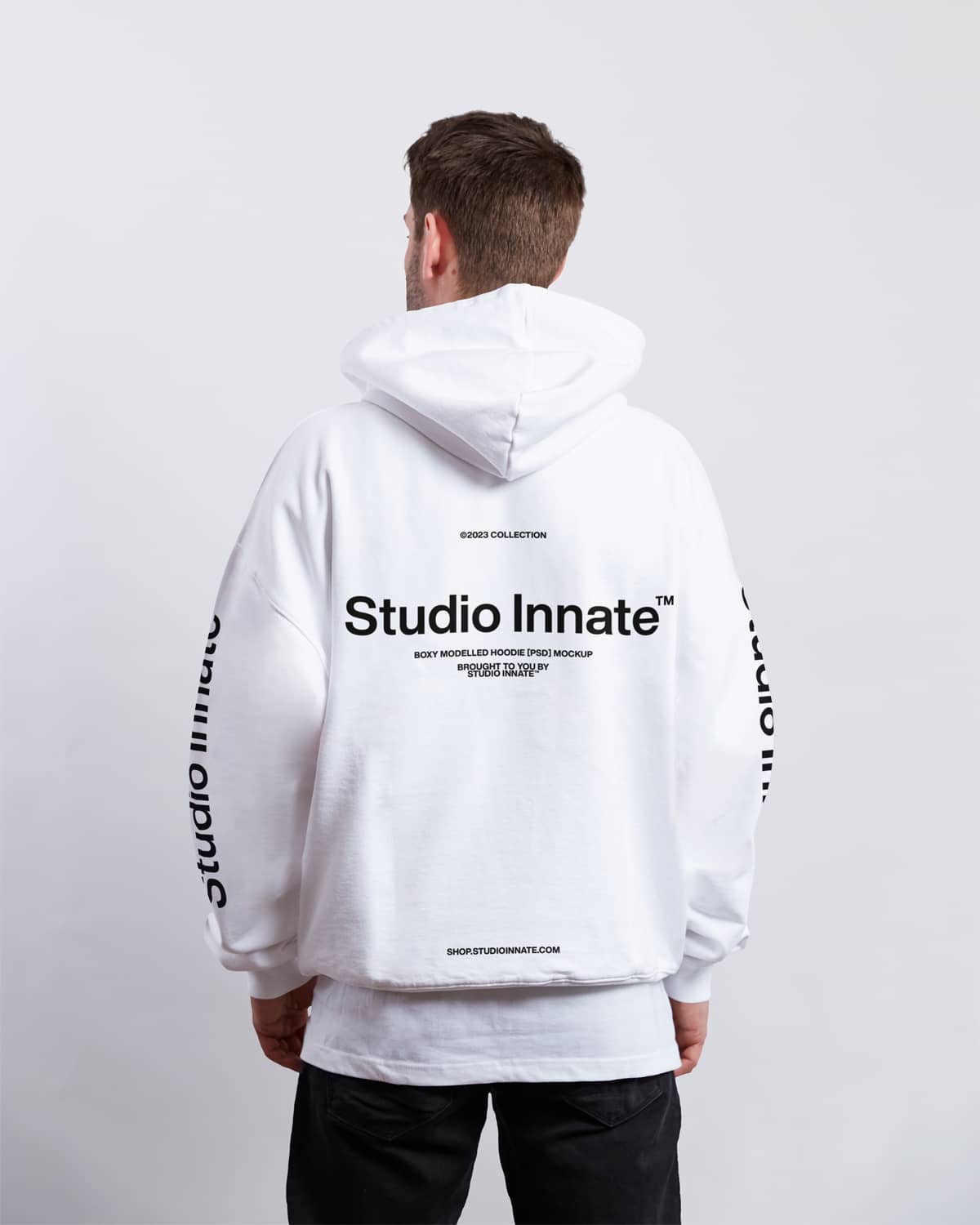 Back of white boxy hoodie mockup on a model